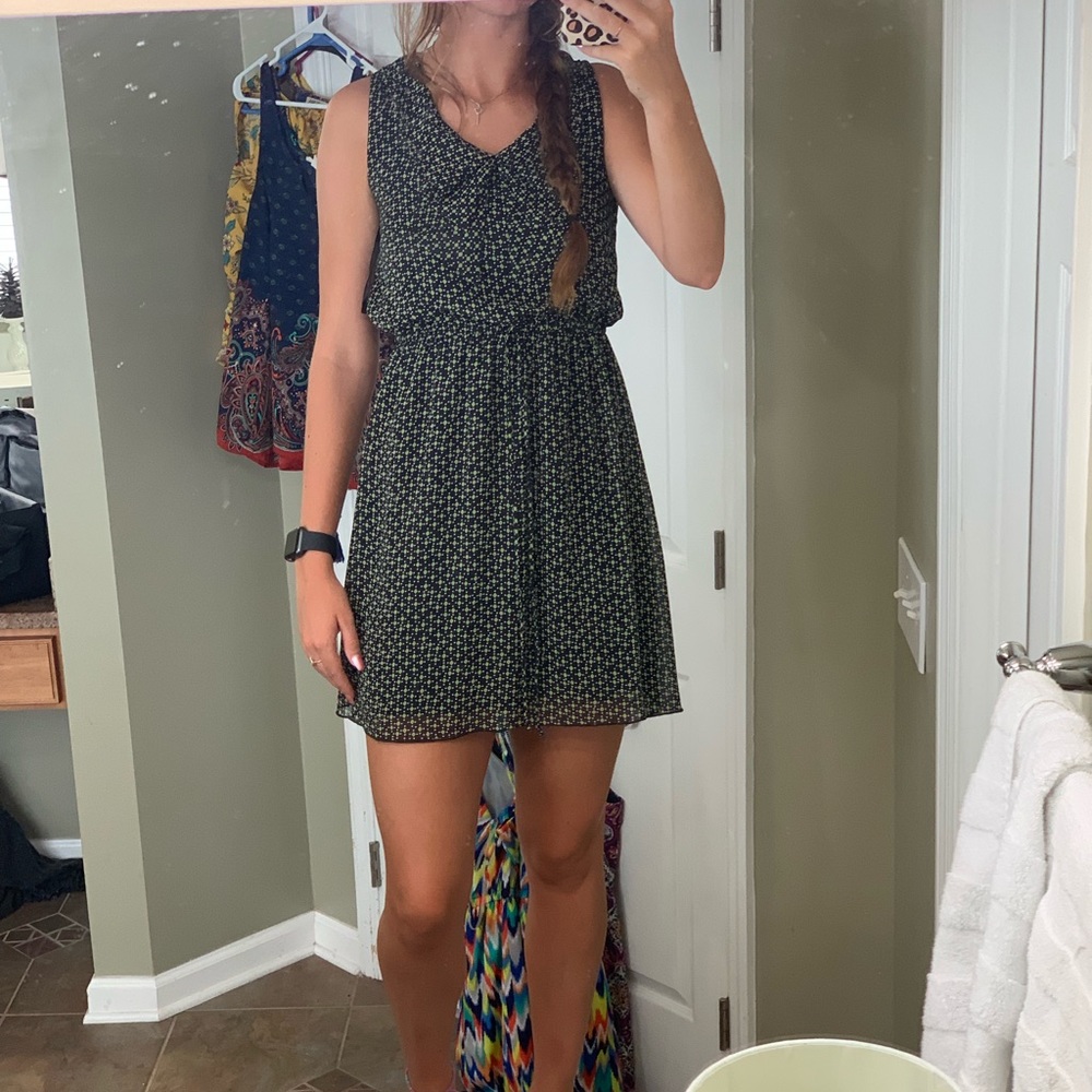 green and black patterned dress